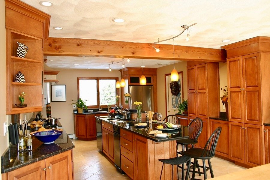 Cherry kitchens create a warm, inviting atmosphere for any house.