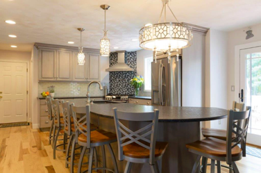 The black and white mosiac adds a stunning element while using the kitchens new color palette.