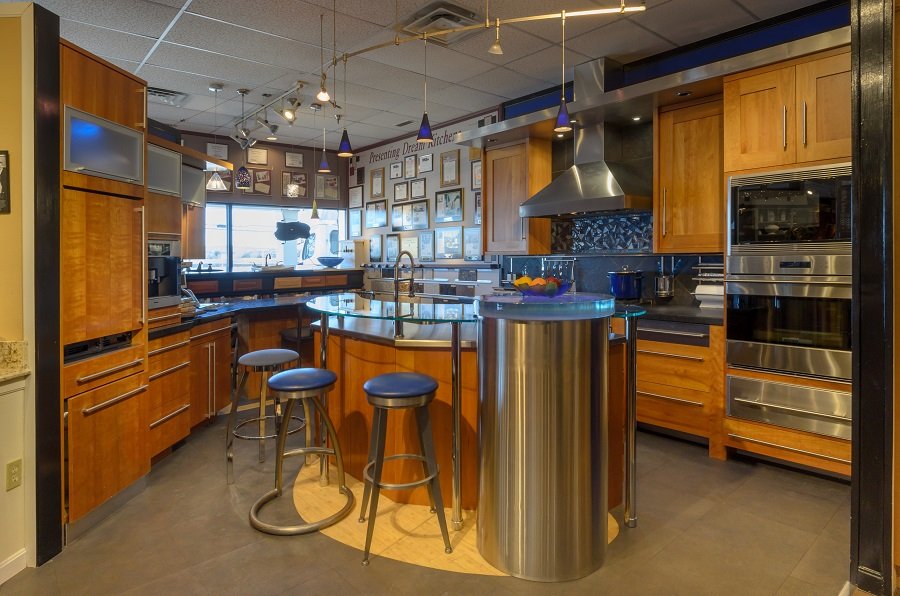 Kitchen design consultation at home with a designer and homeowner discussing ideas.